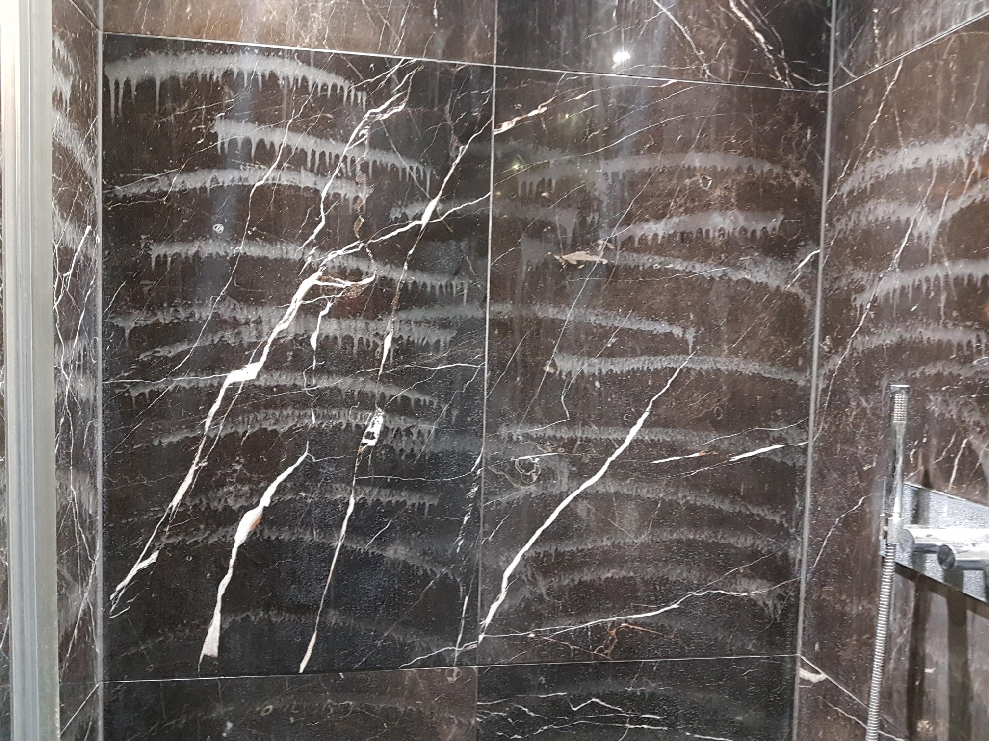 Damaged Marble Shower Wall Before Restoration Ealing